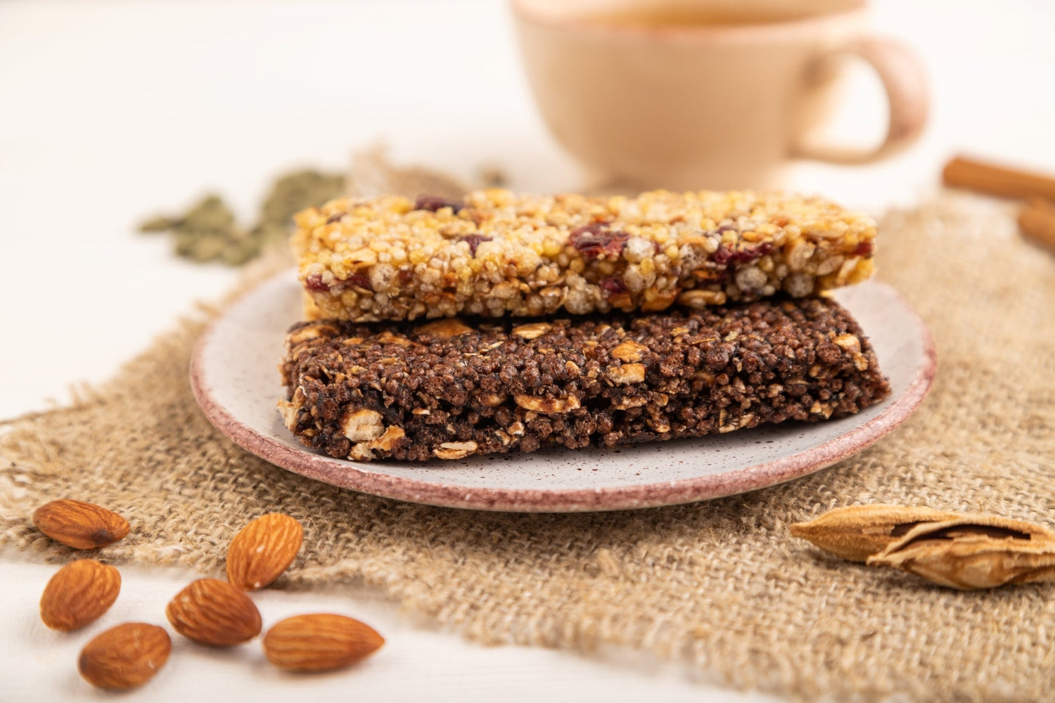 Close-up of no-bake energy bars with caramel nuts and flakes, made using Alcami Elements’ Life Enhancing Blend.