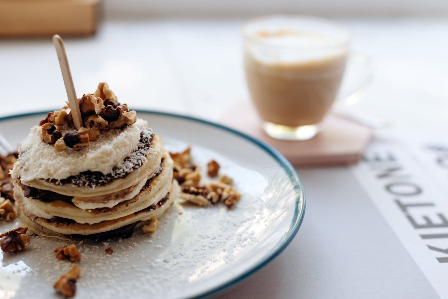 Stack of fluffy wellness pancakes served with coffee, made using Alcami Elements’ Life Enhancing Blend for energy.